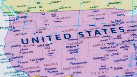 close-up of the country word united states on a world map with the detailed name of the capital city