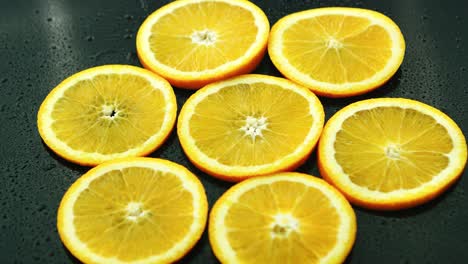 orange slices on dark desk