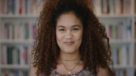 portrait beautiful young mixed race woman student laughing enjoying education lifestyle happy female with frizzy in library bookstore background