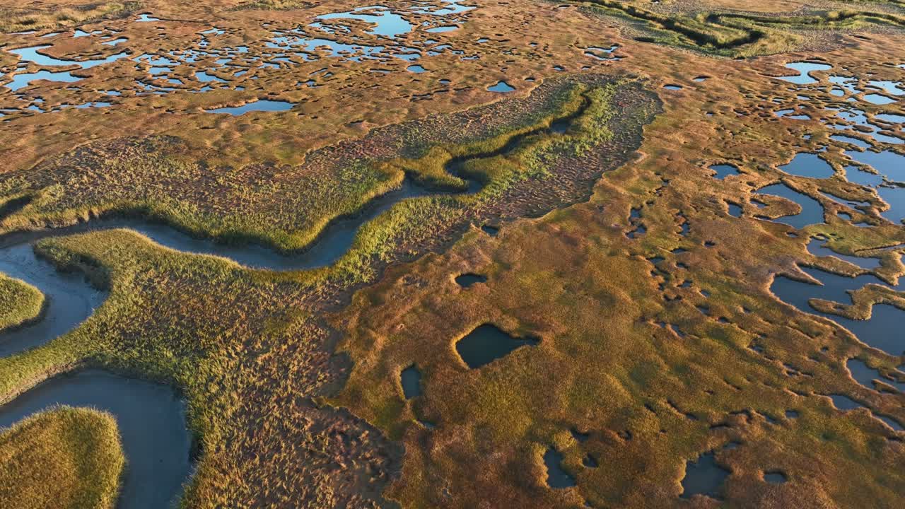 A winding salt marsh at sunrise in cape cod, barnstable massachusetts, aerial view
