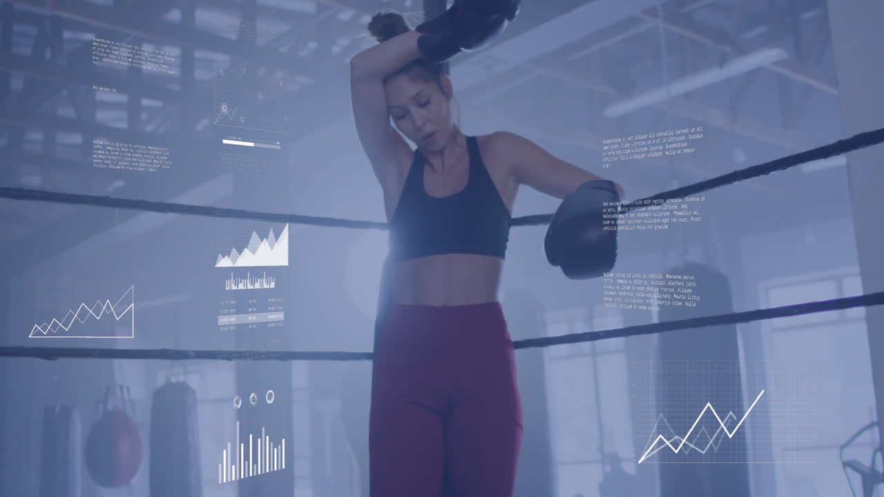 Wearing boxing gloves, woman resting against ropes with animation data graphics