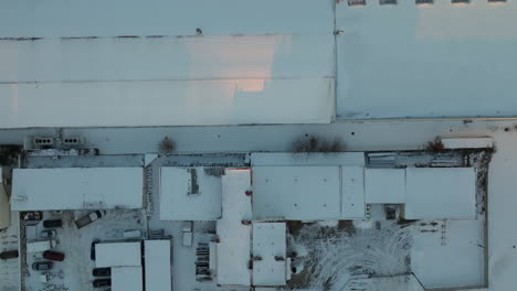 Flying-Above-Buildings-In-Winter-In-Dabrowa,-Gdynia,-Poland