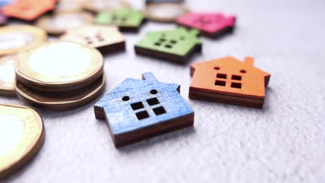 wooden houses and coins