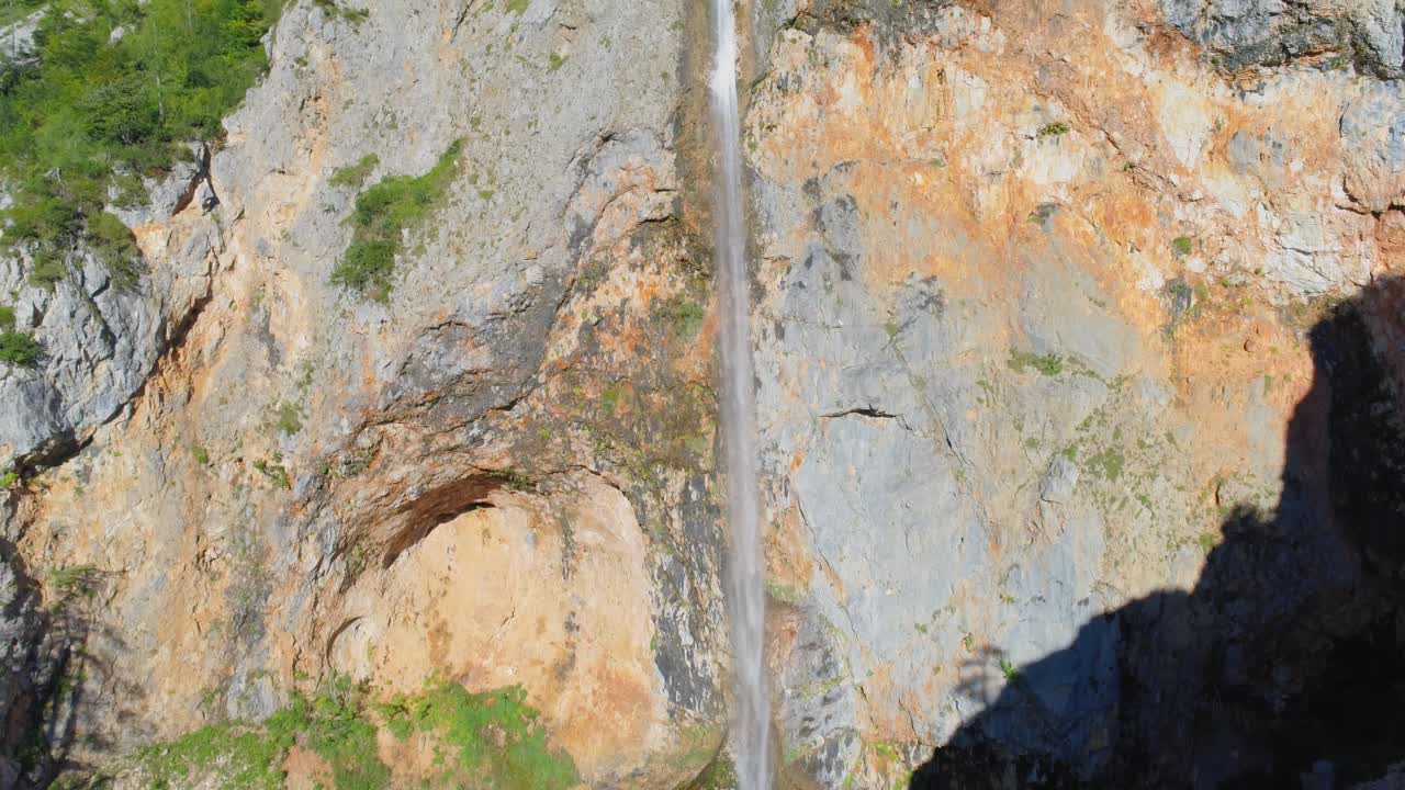 Aerial jib up revealing Rinka falls, the second highest waterfall in Slovenia