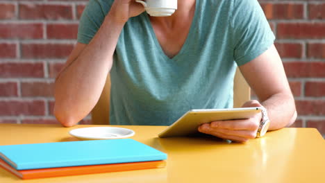 College-student-working-on-his-digital-tablet