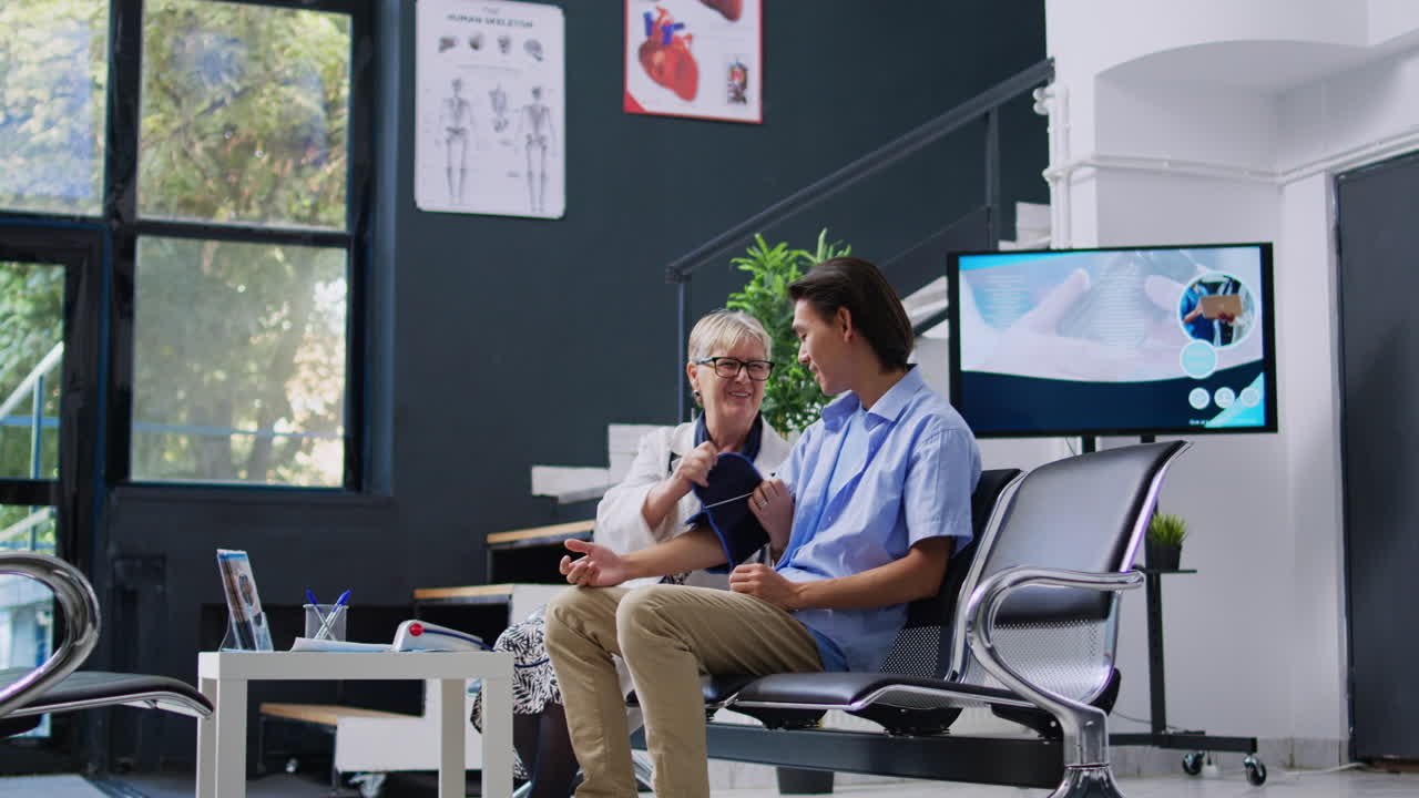 Doctor Checking Patient's Blood Pressure in Clinic