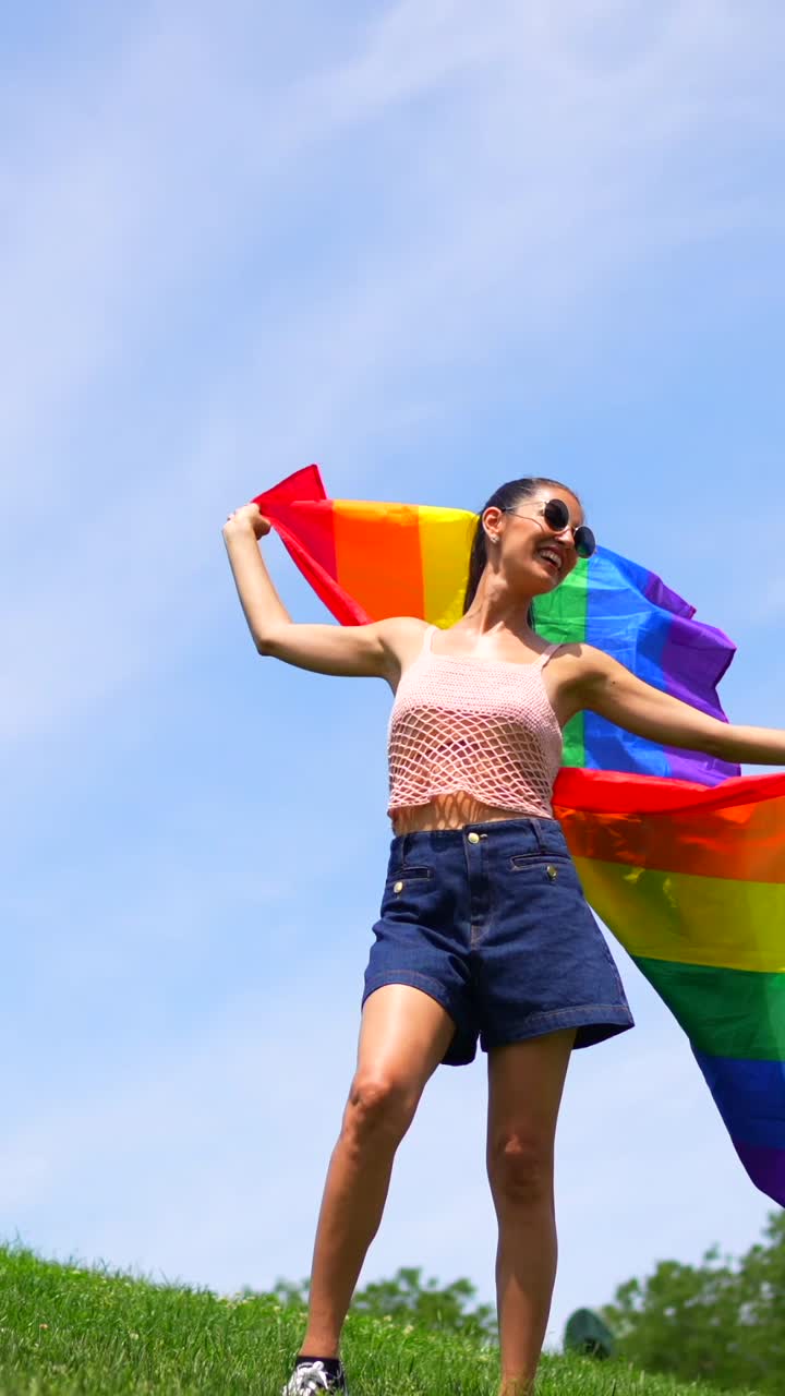 Woman celebrating with a pride flag