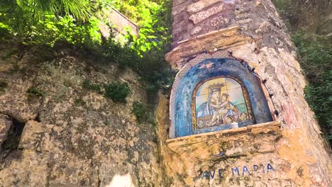 mural of religious figure on stone wall