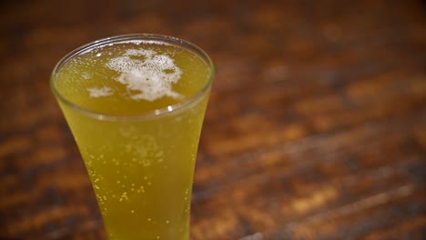 a glass of beer on a table