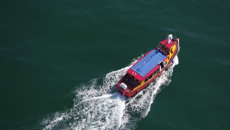 Brixham-boat-speeding-away-Devon-UK