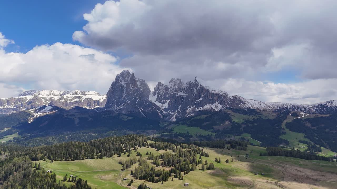 Alpe di Siusi and Sassolungo Group in the Dolomites, with a drone’s circular flight over alpine meadows and snow-dusted peaks