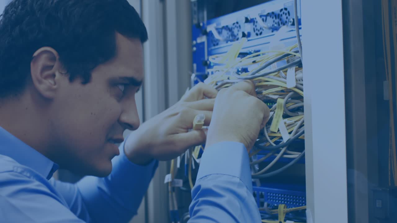 Animation of stains over male worker inspecting server room