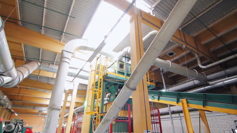 modern factory interior. plant inside view with metal pipes