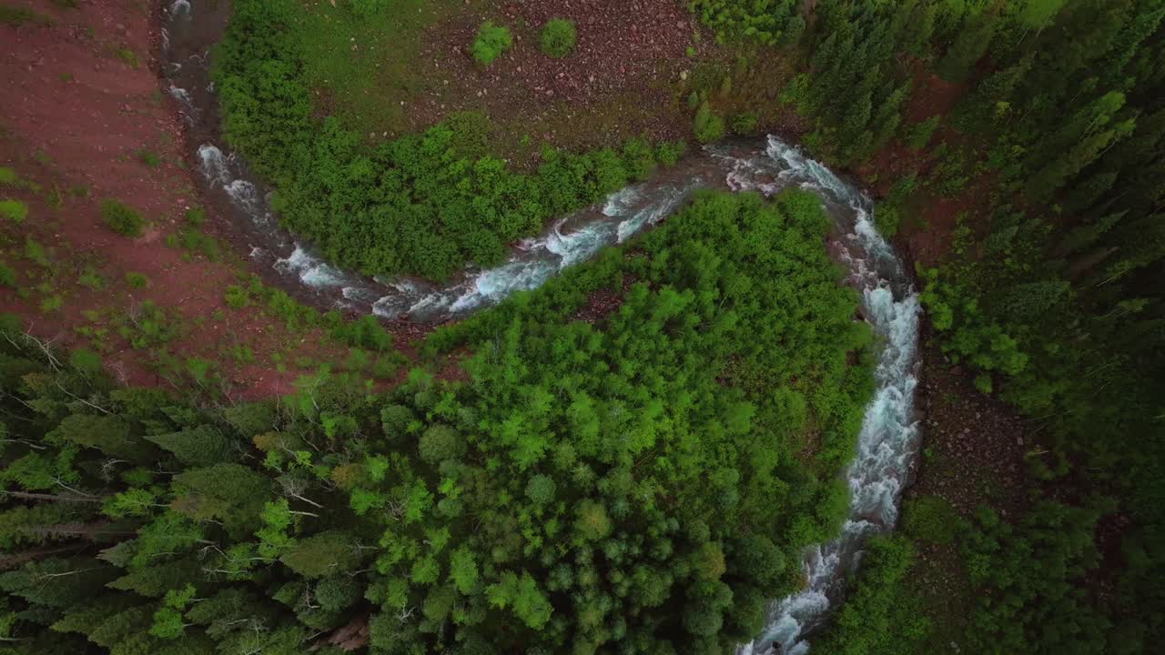 Aspen Snowmass Maroon Creek Roaring Fork Colorado River Maroon Bells Wilderness Rocky Mountains Colorado aerial drone spring summer windy curves White River National Forest afternoon shade cloudy up