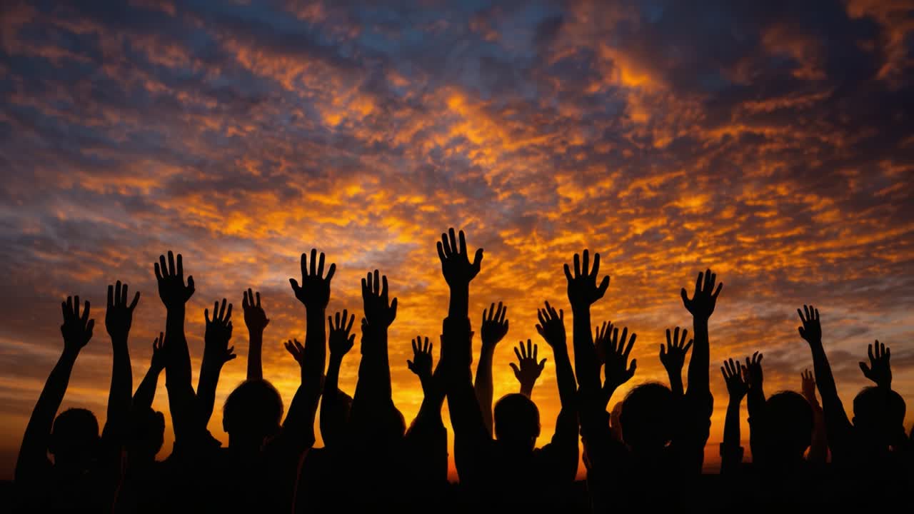 Silhouetted Figures Beneath a Vibrant Sunset Sky, Reaching Upward with Enthusiasm and Joy as the Day Comes to a Close, Creating a Sense of Unity and Celebration