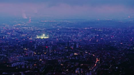 evening haze blankets pristina cityscape in sweeping cinematic twilight motion