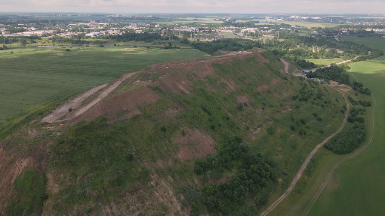 Household waste landfill. Closed for processing. Environment protection. Close-up shot. Aerial photography