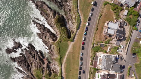 aerial flyover of rocky coastline - waterfront properties