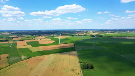 aerial view of powerful wind turbine farm for energy production on beautiful cloudy sky at highland