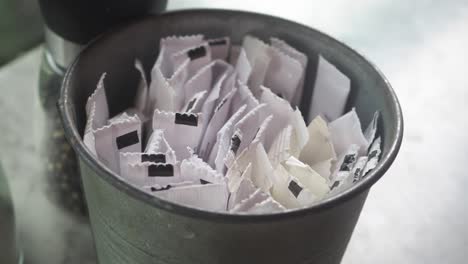 sugar packets in a container