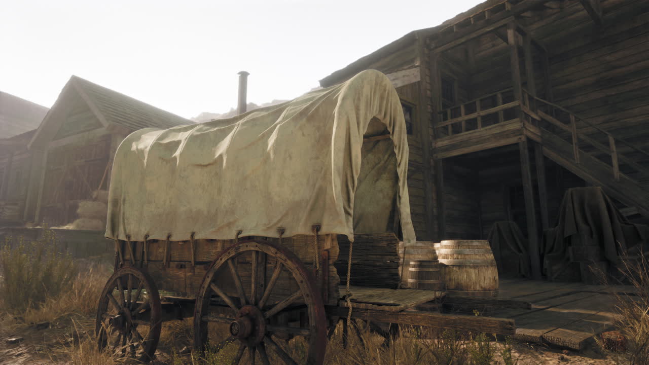 старый западный вагон перед деревянными зданиями