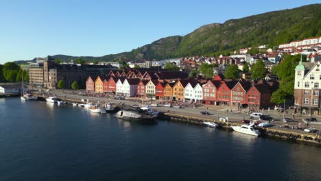 wide aerial shot of bryggen famous wharf in bergen, norway, a unesco world heritage site, on a clear summer day.