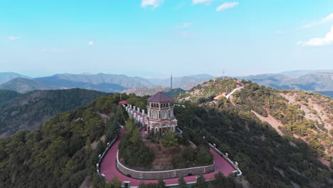 scenic aerial view of archbishop makarios iii tomb nestled on a mountaintop surrounded by lush hills