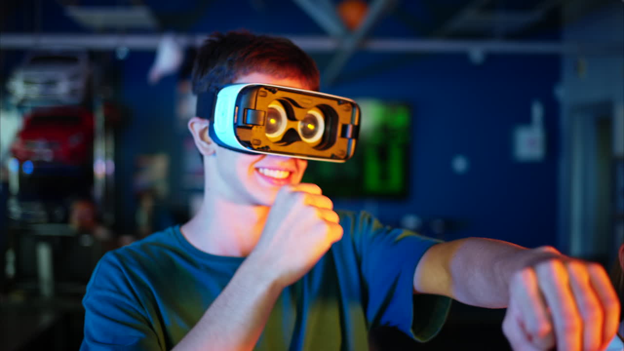 Young engineer with VR virtual reality headset having fun and dancing in research laboratory