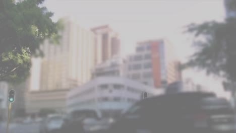 animation of thumbs up icon with increasing likes over world map against time-lapse of city traffic