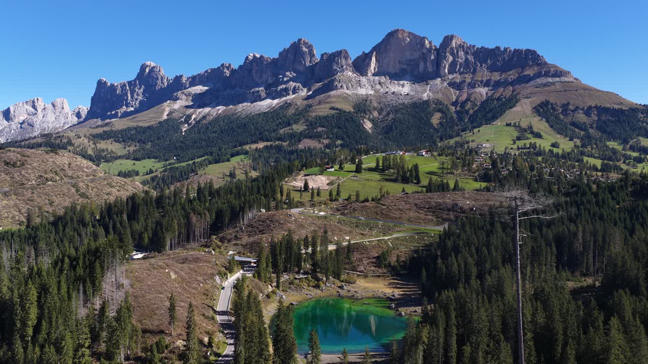Karersee, in the italian Dolomites. Aerial revealing drone video