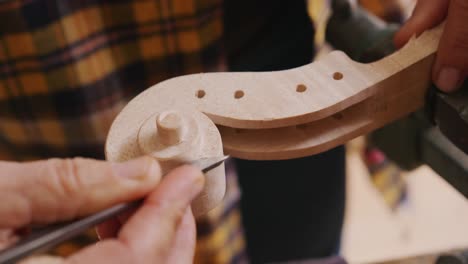 female luthier at work in her workshop