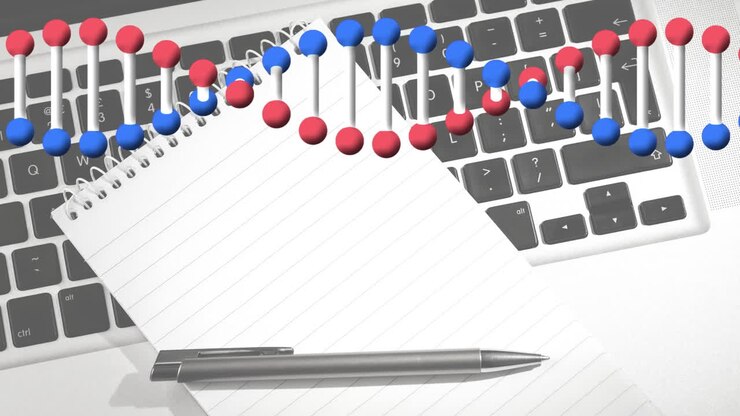 Animazione di una doppia elica di DNA che ruota sopra un laptop, un taccuino e una penna su una scrivania.