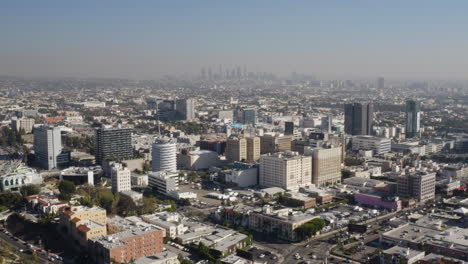 Aerial-over-historic-downtown-Hollywood-with-downtown-Los-Angeles-in-the-background