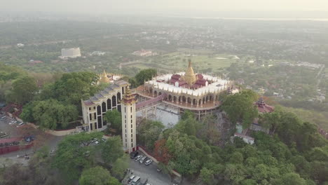 mandalay hill pagoda in downtown mandalay, myanmar during sunset