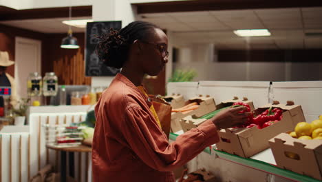 shopper choosing freshly harvested vegetables from market