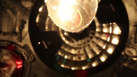 slowly moving away from bottom of disco ball, bulb having great details starting on side edge and moving towards top