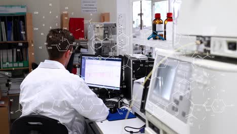 Animation-of-chemical-formulas-over-back-view-of-caucasian-male-lab-worker-using-computer