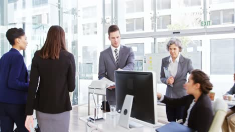 businesswomen interacting with each other while walking