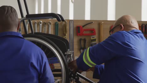 Workers-making-a-wheelchair