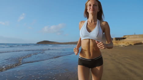 woman athlete silhouette running on beach sprinting waves crashing on seaside morning background slow motion