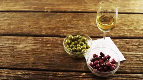 wine served with green and red olives