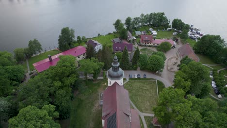 evangelic johanniterkirche church in mirow, germany with a view of the lake