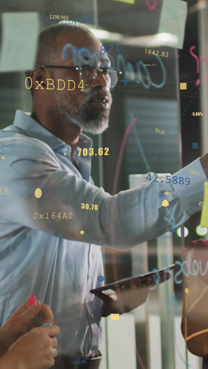 Vertical video: Lead pointing writing glass for tech planning placing yellow note as charts rising