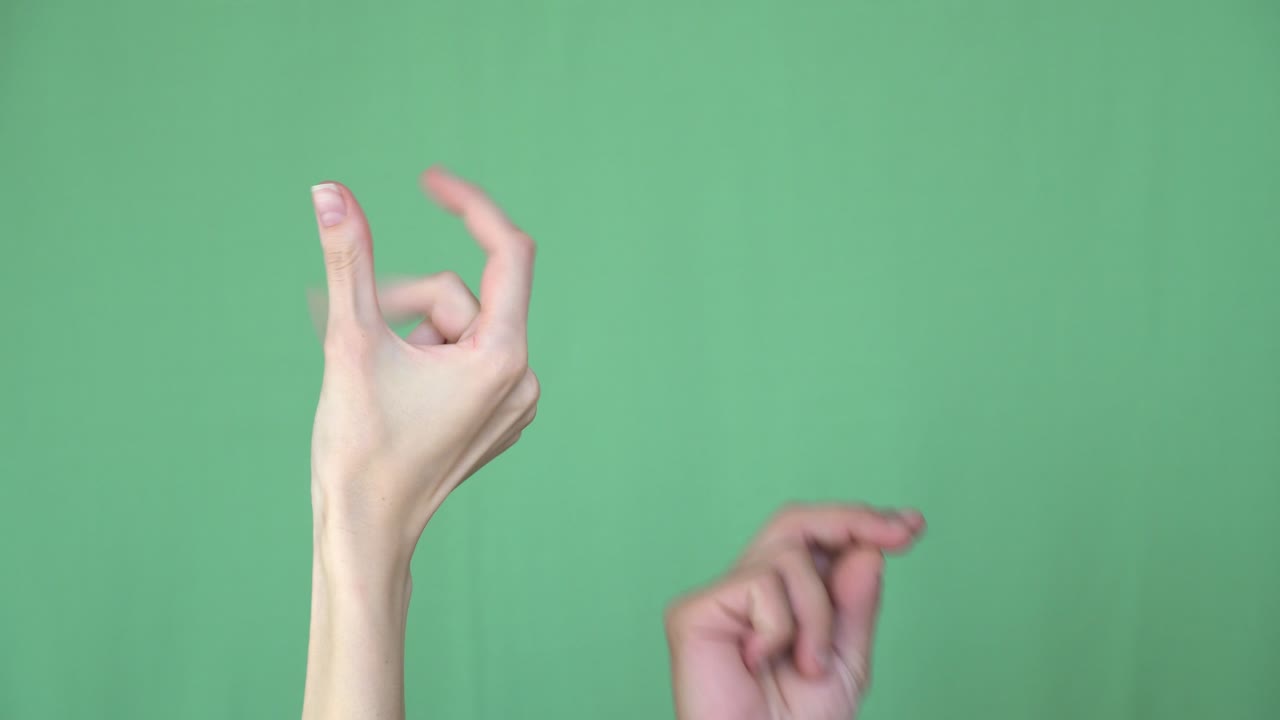 Easy Concept. Finger Snapping Hand Gesture. Hand close-up. Chroma key background. Green Screen. Isolated
