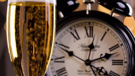 new year's eve celebration with champagne and clock