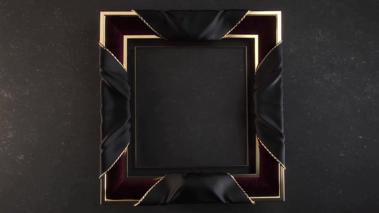 Ornamental frame rotating on play in studio for product showcase, showing gold-trimmed black satin