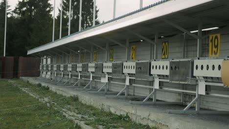 panorama of targets for shooting at biathlon stadium. numbering of shooting sports targets. empty shooting range. winter sports concept