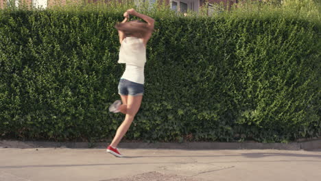 funny woman dancing loop girl having fun celebrating with dance in street lively female dancer outdoors 4k