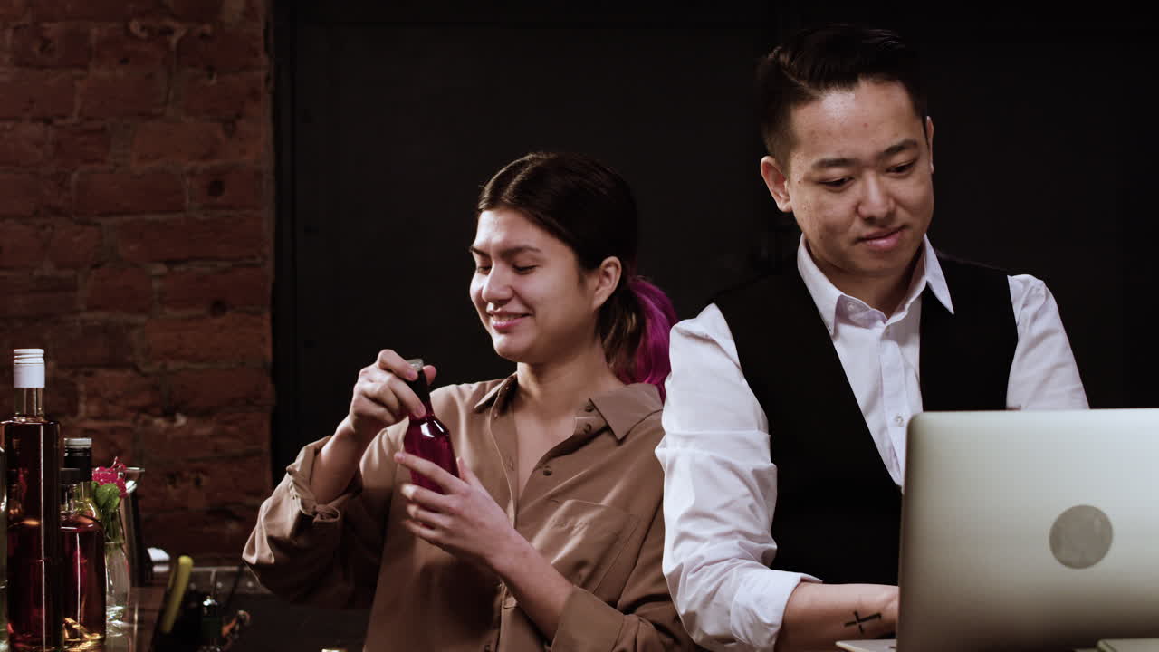 Bartenders doing inventory