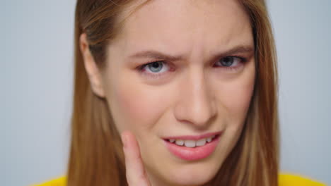 Closeup-sick-young-woman-coughing-at-camera-on-grey-background.-Lady-feeling-bad